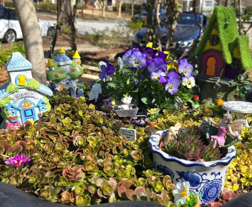 21. Sunny Succulent Village with Floral Flair