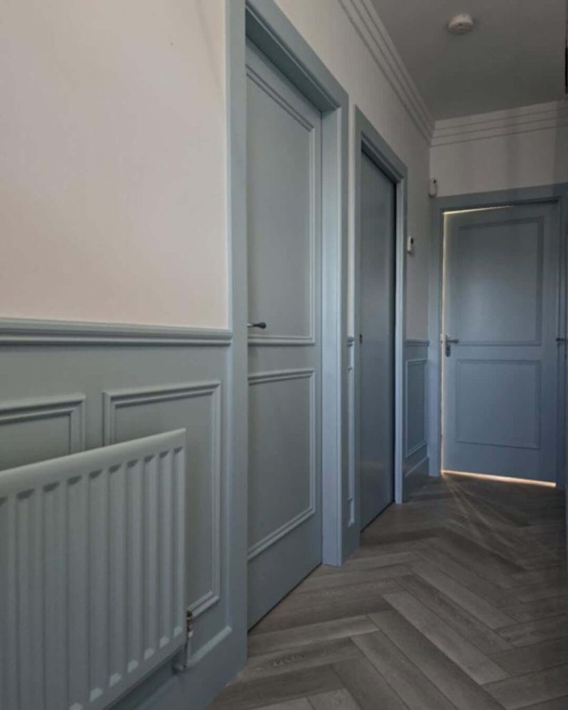 21. Half-Wall Paneling for a Monochromatic Hallway Refresh