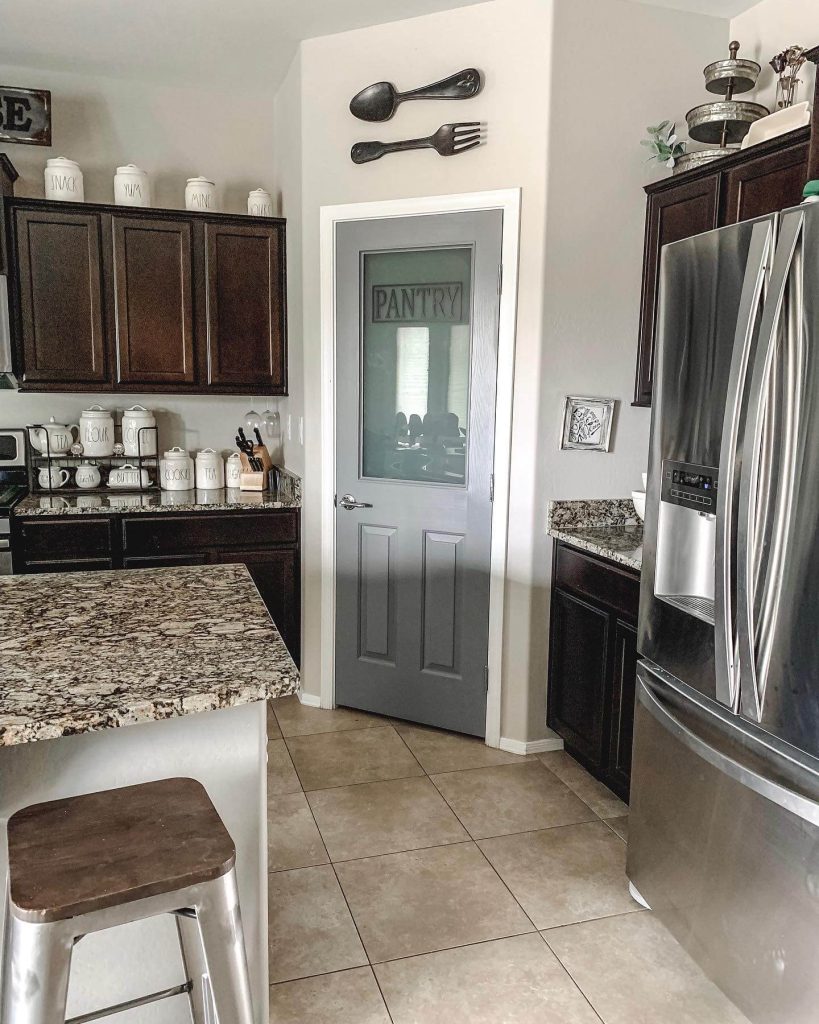 22. Sleek and Simple with a Cool-Toned Door