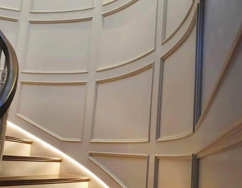 26. Curved Wall Paneling for Sculptural Staircase Drama