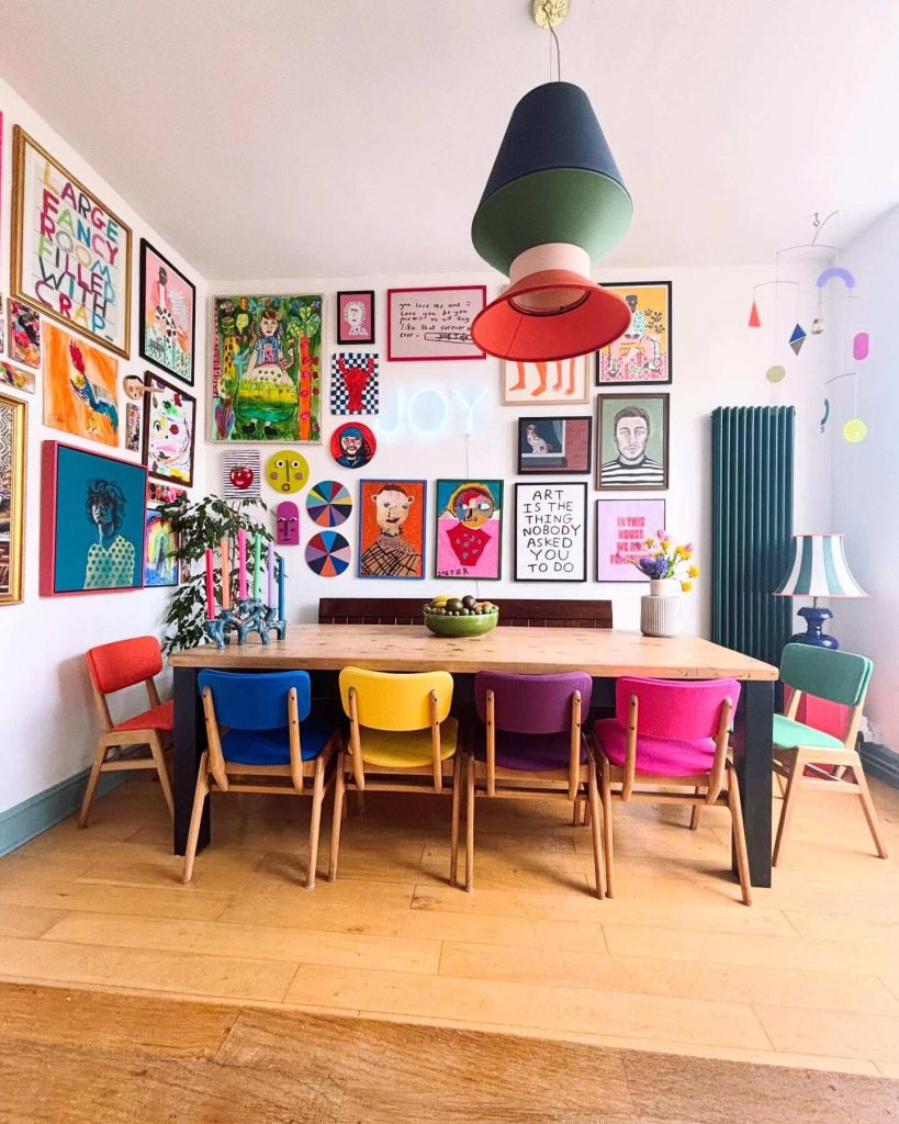 27. Playful Rainbow Gallery Wall in a Colorful Dining Room
