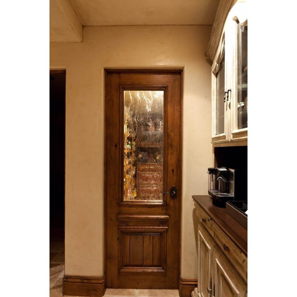 27. Old-World Charm with Ornate Wood Detailing