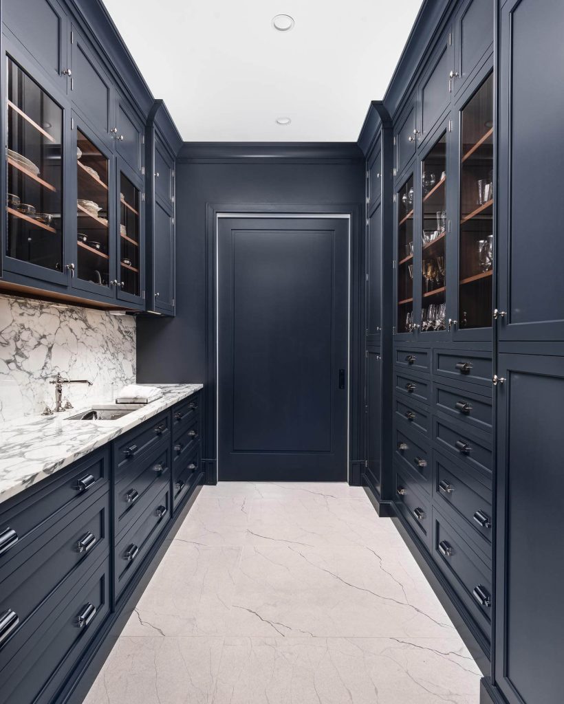 28. Moody and Luxe with Navy Built-ins and Marble Drama