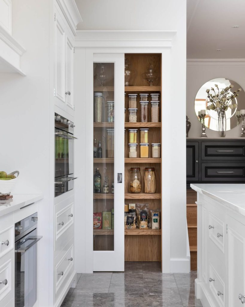 28. Sleek Sliding Pantry That Blends In