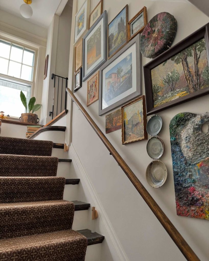 29. Eclectic Staircase Wall with Global Art and Textures