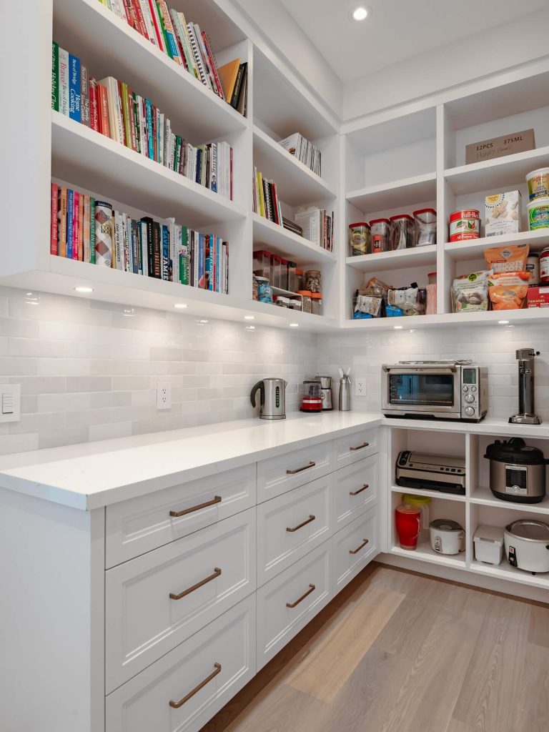 29. Library-Inspired Pantry with Built-In Appliance Station