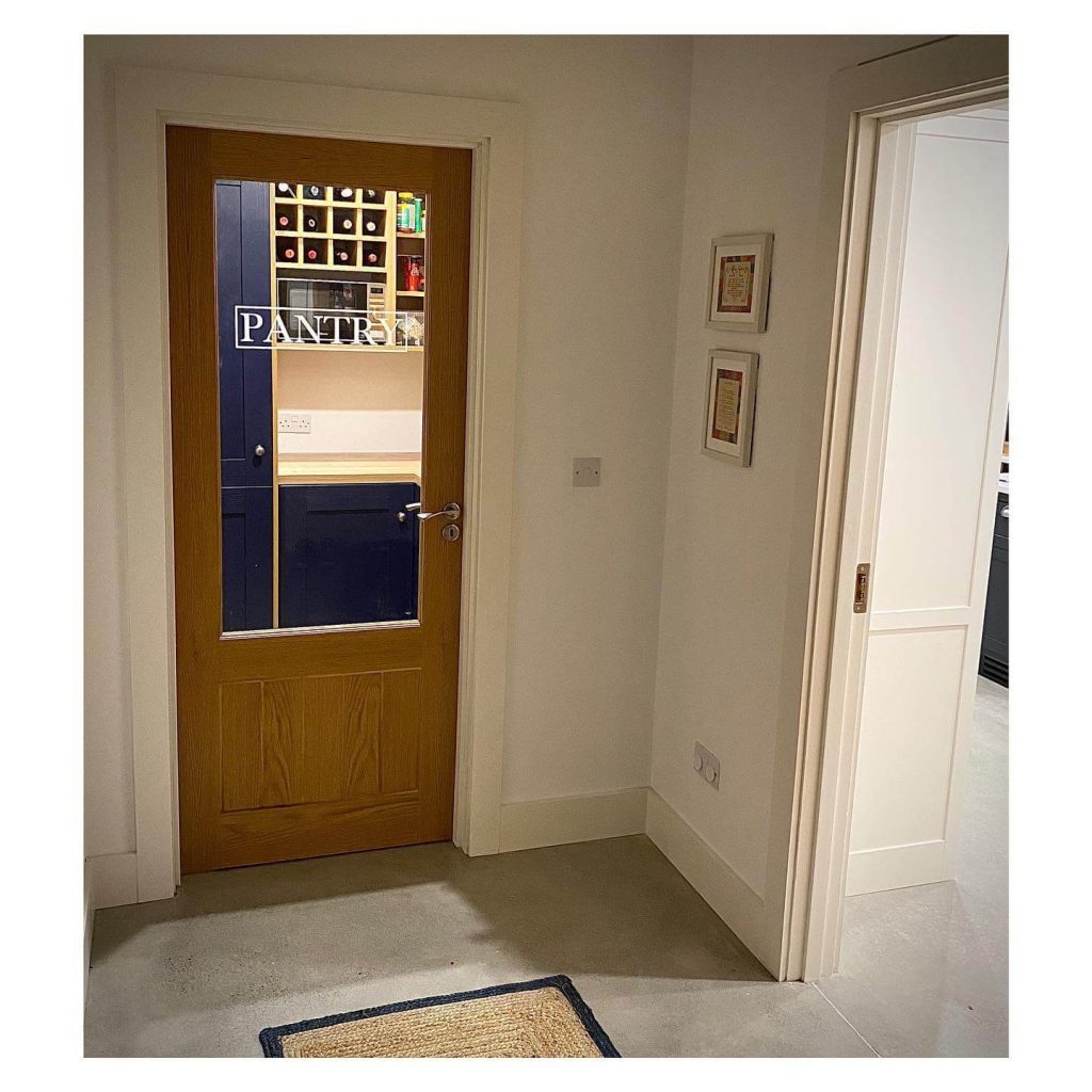 30. Contemporary Clarity with Natural Wood Framing