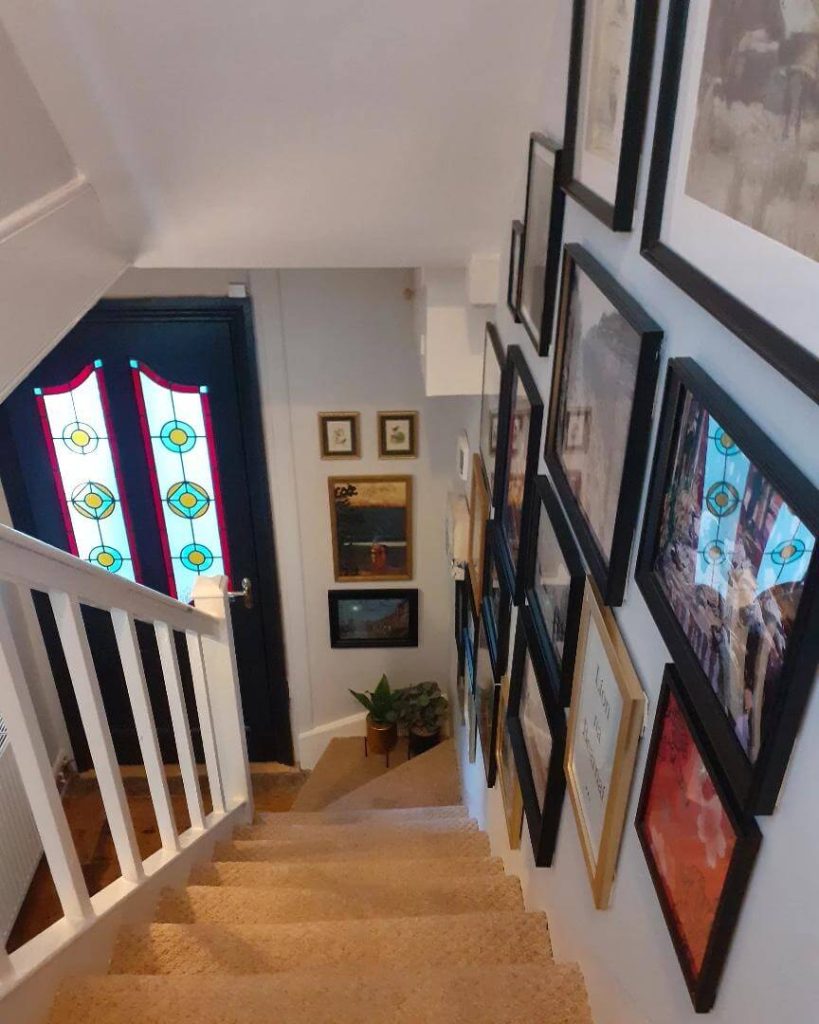 31. Narrow Stairwell Gallery with Framed Layers