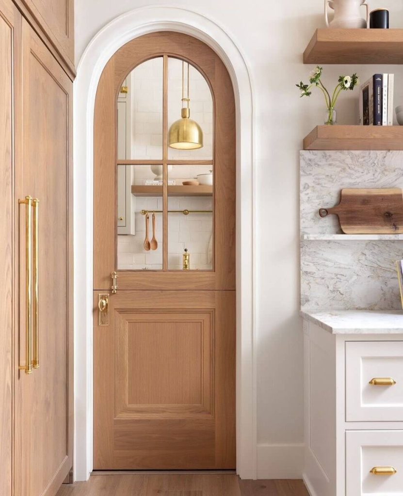 33. Curved Sophistication with an Arched Door