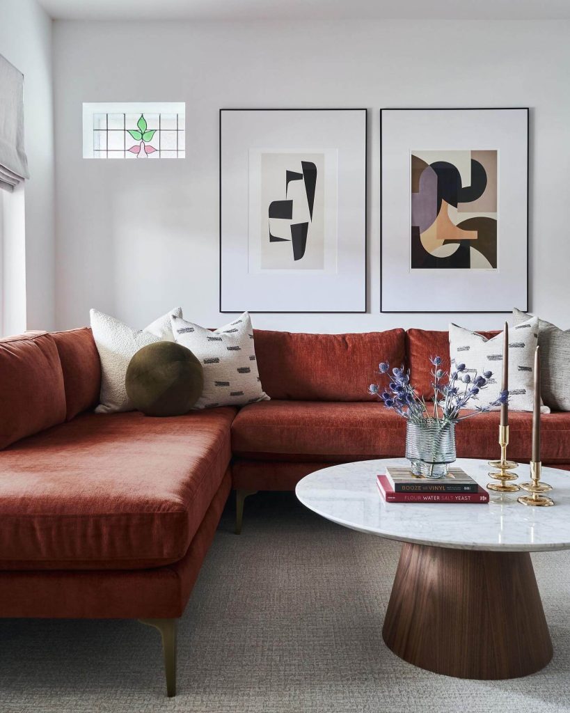 4. Rust Velvet Sofa & Abstract Art for a Contemporary Spin