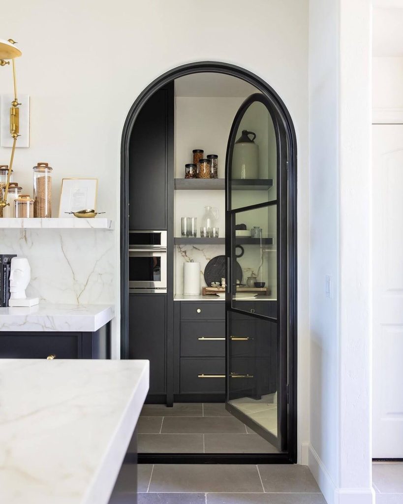 4. Statement Style with an Arched Glass Door