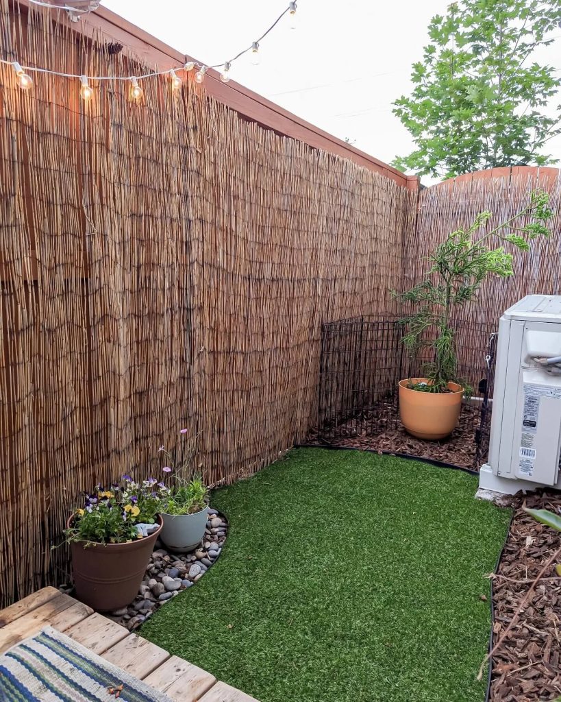 5. Transform a Tiny Corner with Privacy Screens and Faux Grass