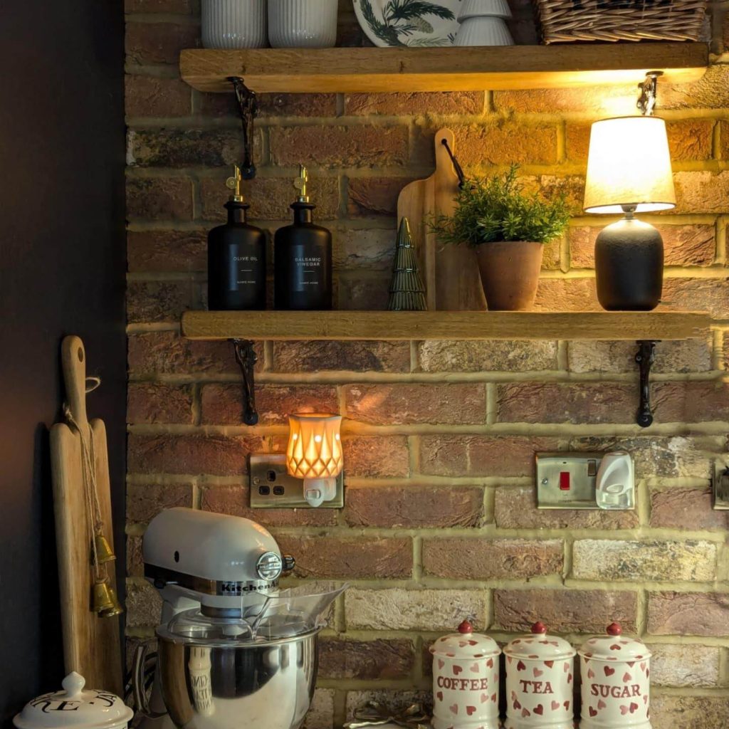5. Cozy Brick Wall Shelving With Warm Lighting