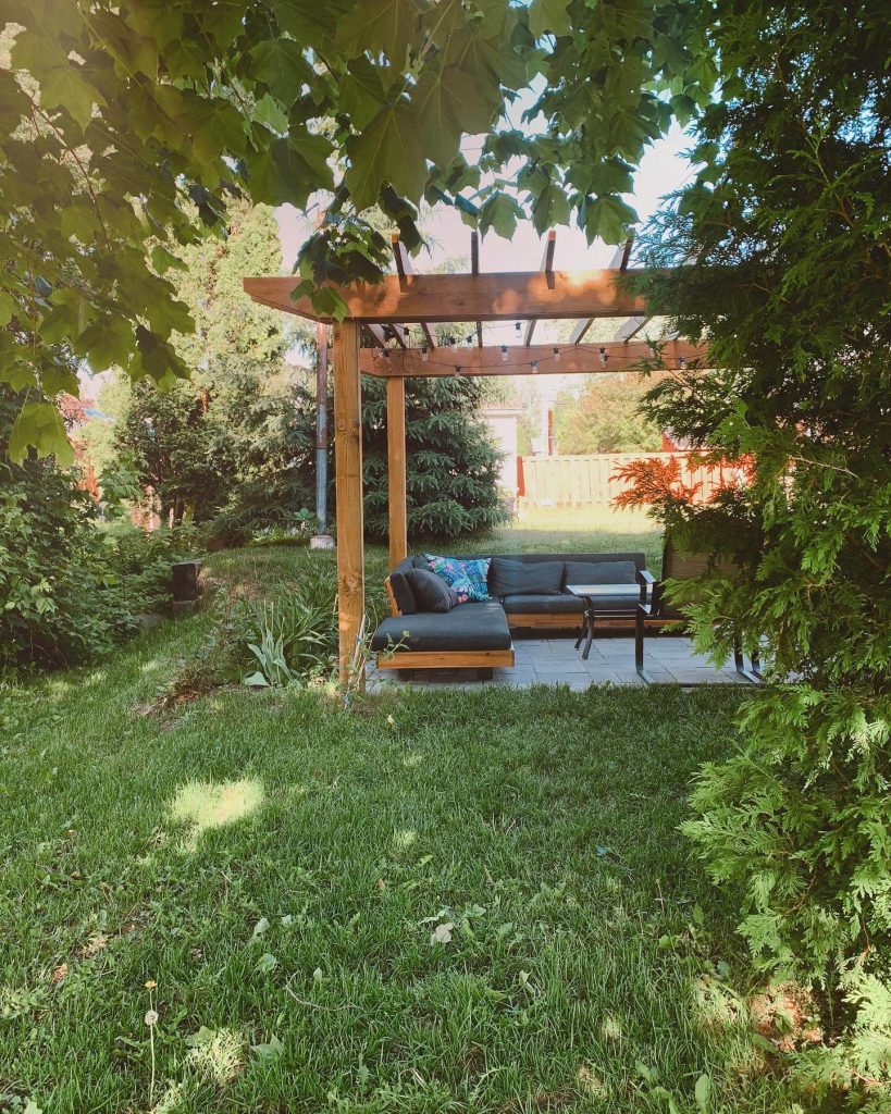 7. Nestle a Pergola Lounge into a Garden Corner