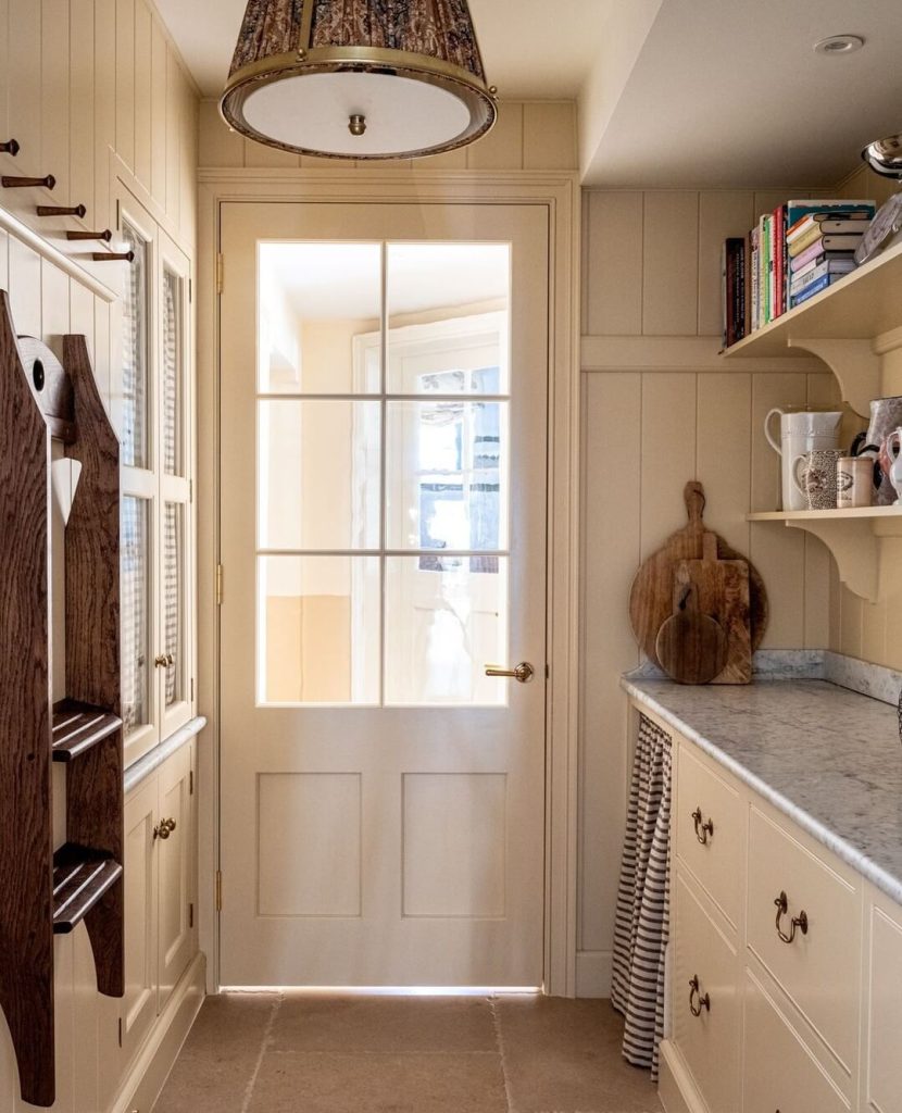 7. Charming Cottage-Style Pantry with Skirted Storage