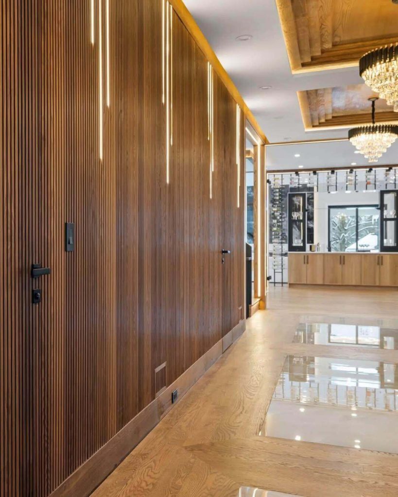 8. Sleek Slatted Wood with Integrated Lighting