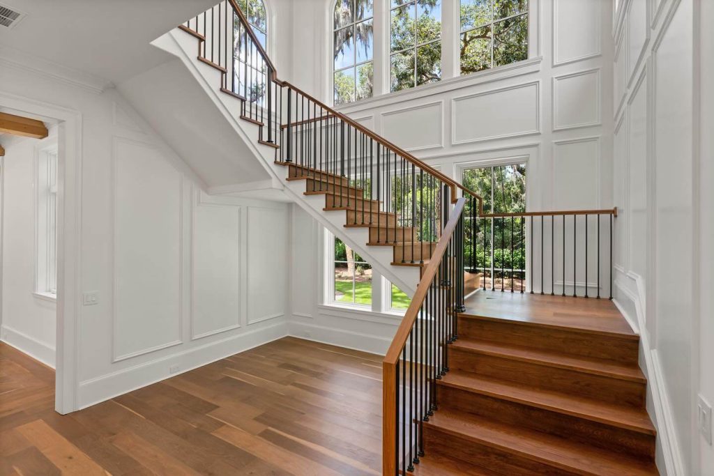 9. Grand Stairwell Framed in Classic Wall Panels