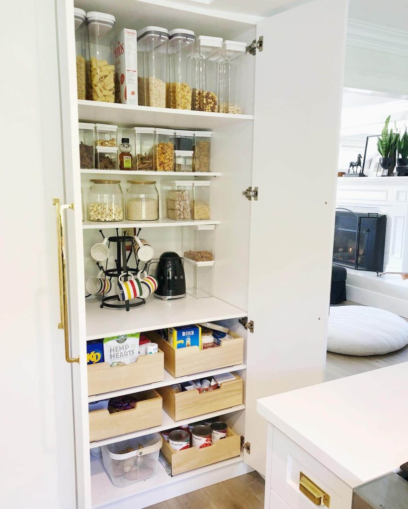 9. Built-In Cabinet Pantry with Pull-Out Drawers and Clear Canisters