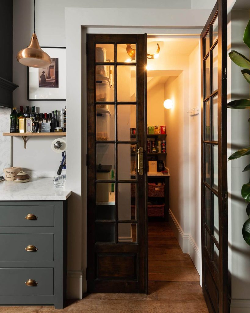 9. Narrow but Mighty Pantry with Glass French Doors