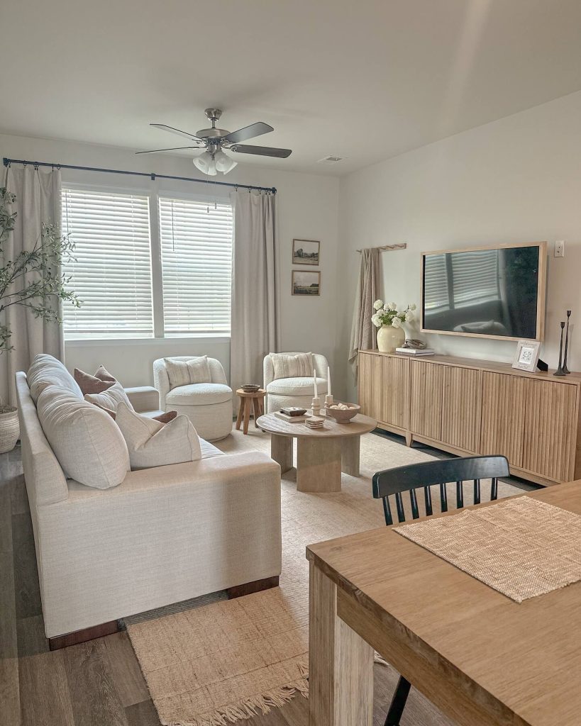 1. Light and Airy Neutral Living Room Layout with Natural Light