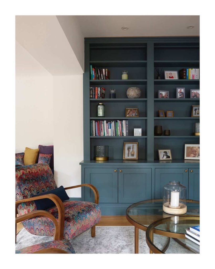 10. Built-In Bookshelves with Modern Seating