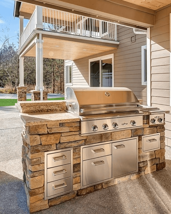 11. Stone-Faced Grill Island with Stainless Steel Storage