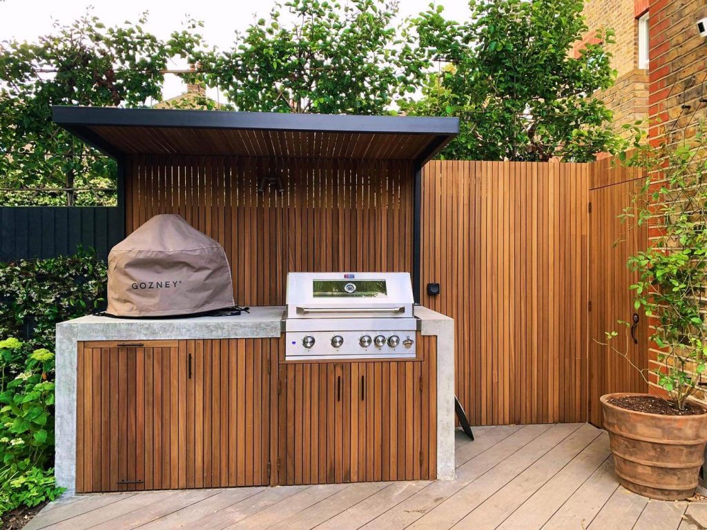 13. Compact Wood-Slat Kitchen with Urban Zen Appeal