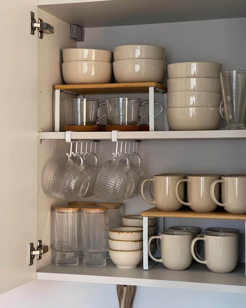 14. Compact Cupboard with Layered and Hanging Mug Organization