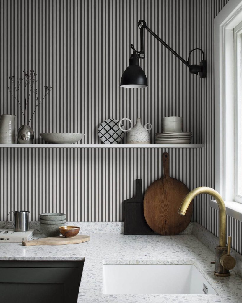 14. Monochrome Minimalism with Floating Shelf Elegance