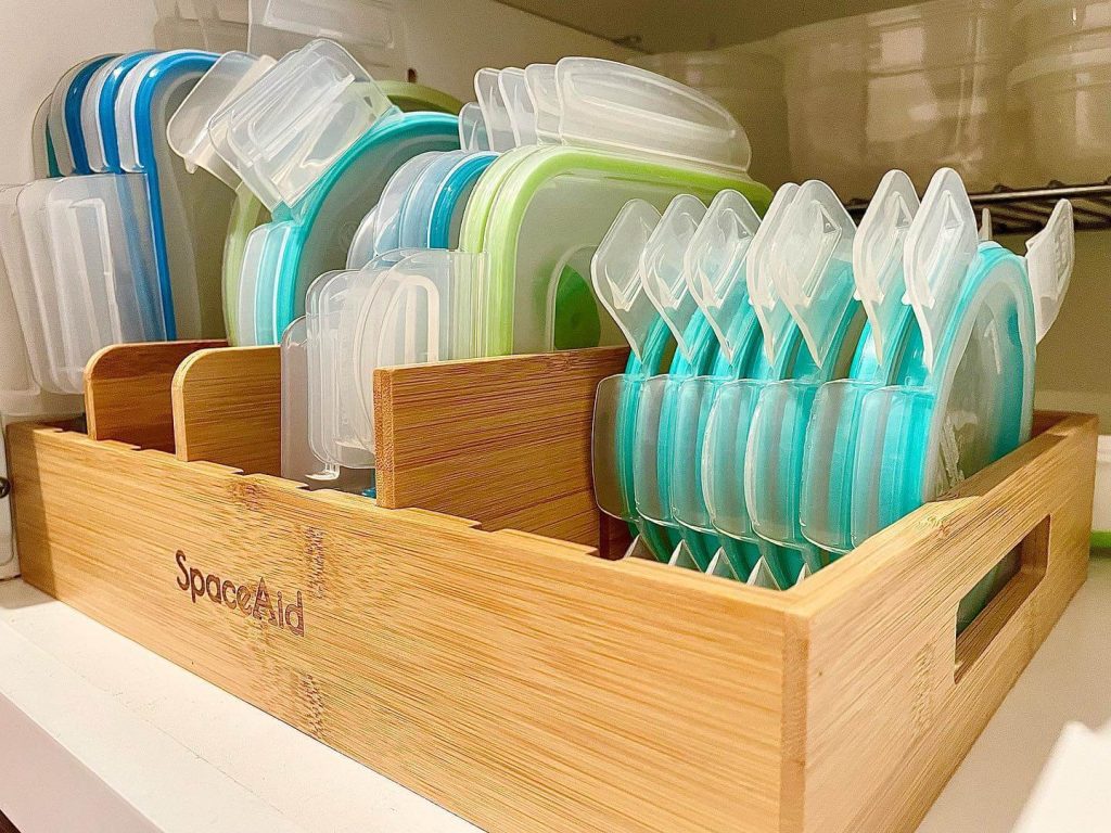 15. Use a Bamboo Lid Organizer to Tame the Tupperware Jungle
