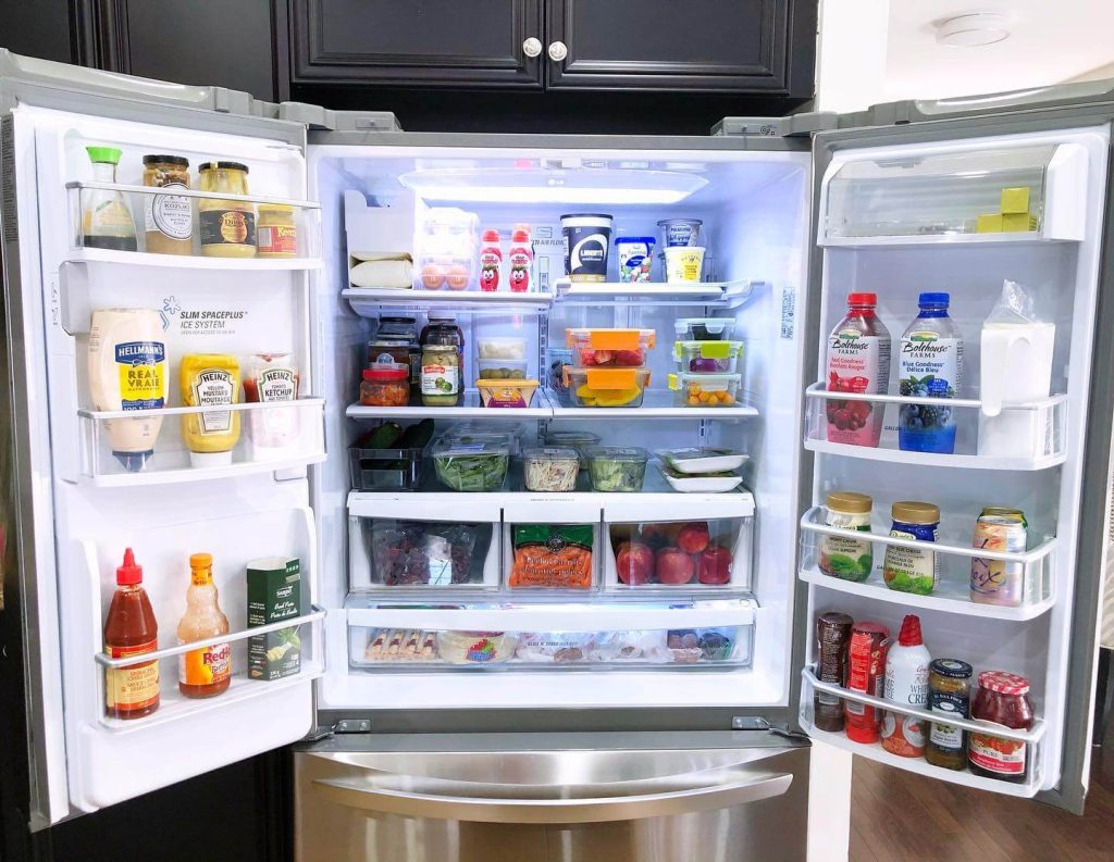 16. Smart and Efficient Organization with Clear Bins for Sauces and Condiments