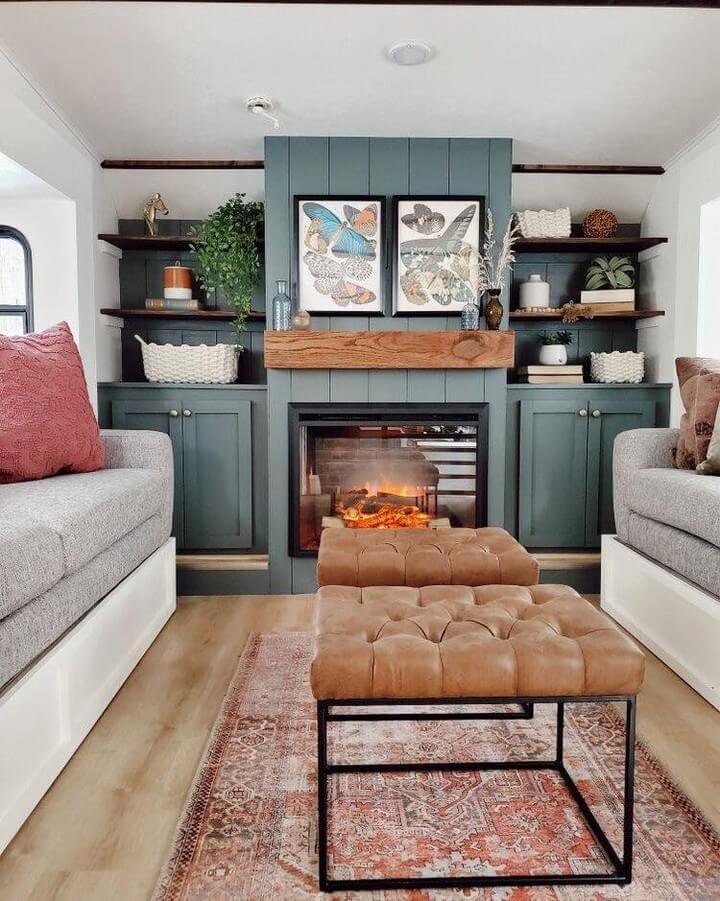 18. Muted Teal with a Cozy Fireplace: A Warm, Inviting Feel