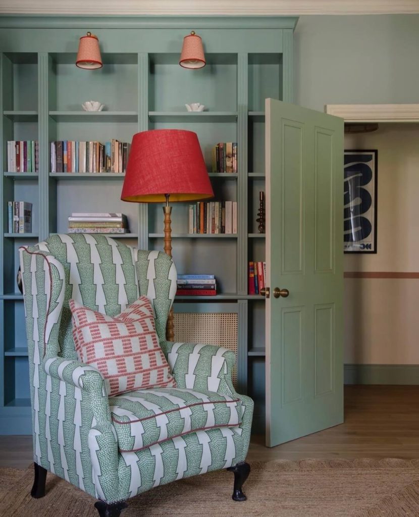 18. Vibrant Color-Filled Bookshelf with Playful Chair