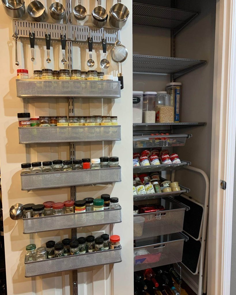 19. Wall-Mounted Spice and Utensil Organizer in a Utility Closet