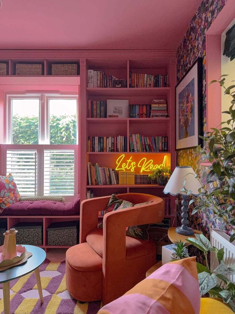20. Bright Pink Reading Nook with Neon "Let's Read" Sign
