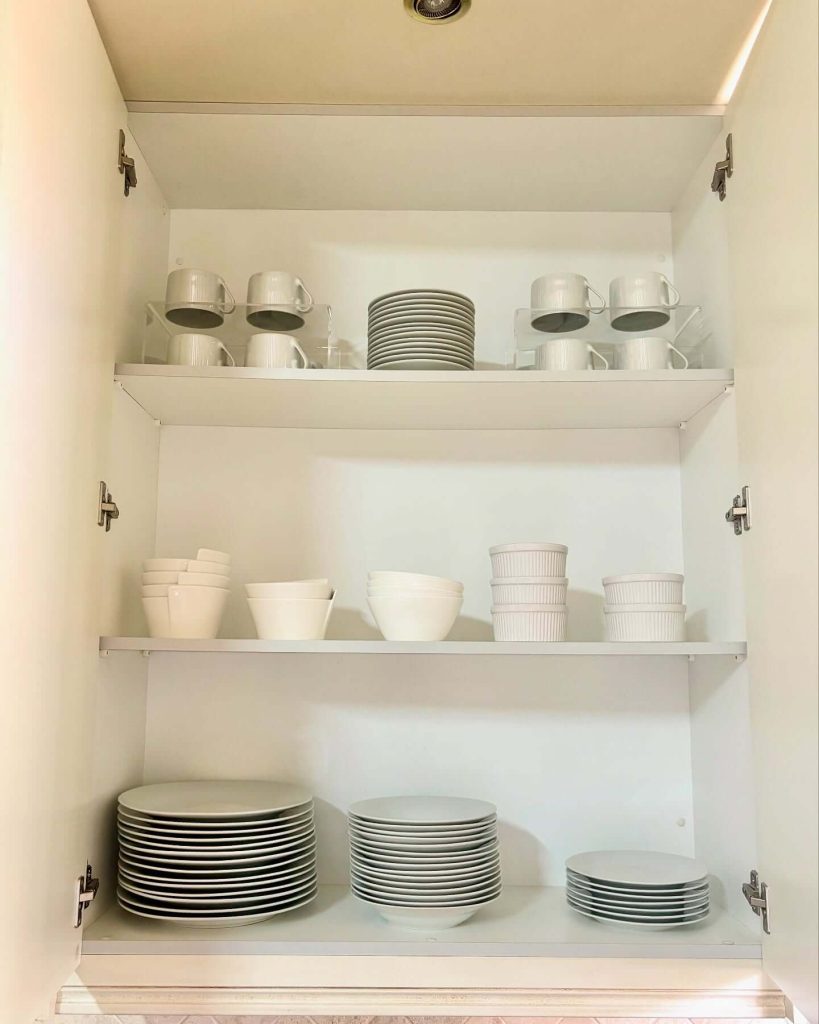 20. Streamlined Glass Shelving for a Sleek Finish