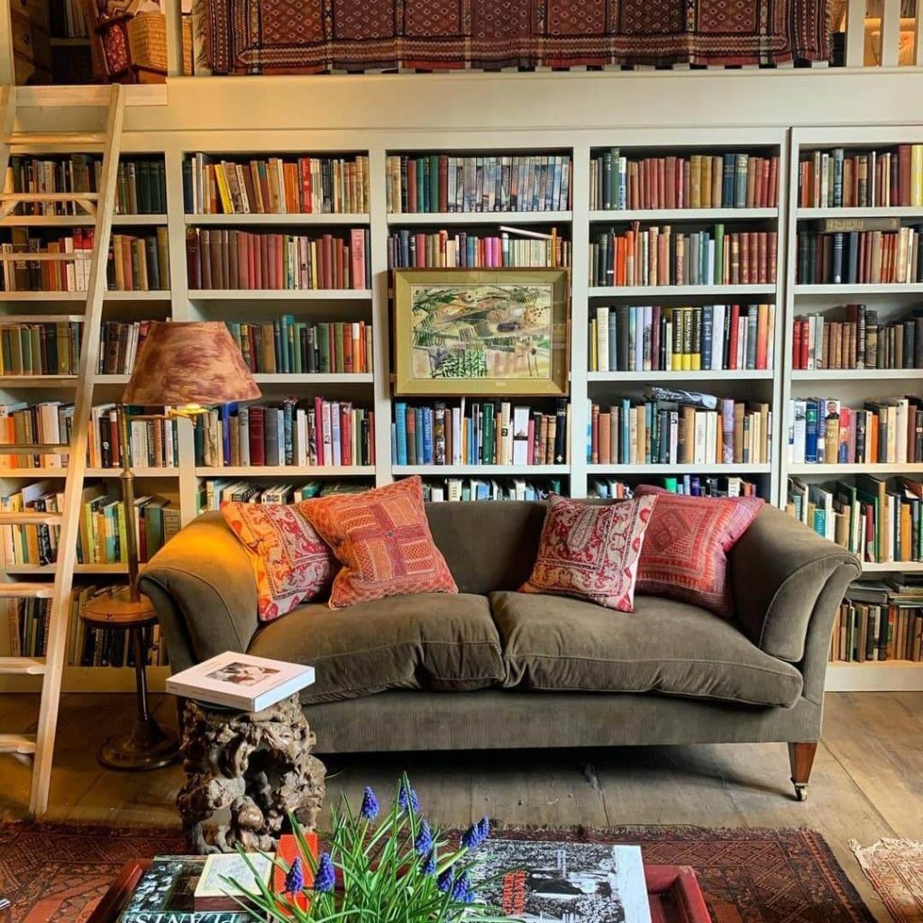 21. Classic Bookshelves with a Cozy Ladder