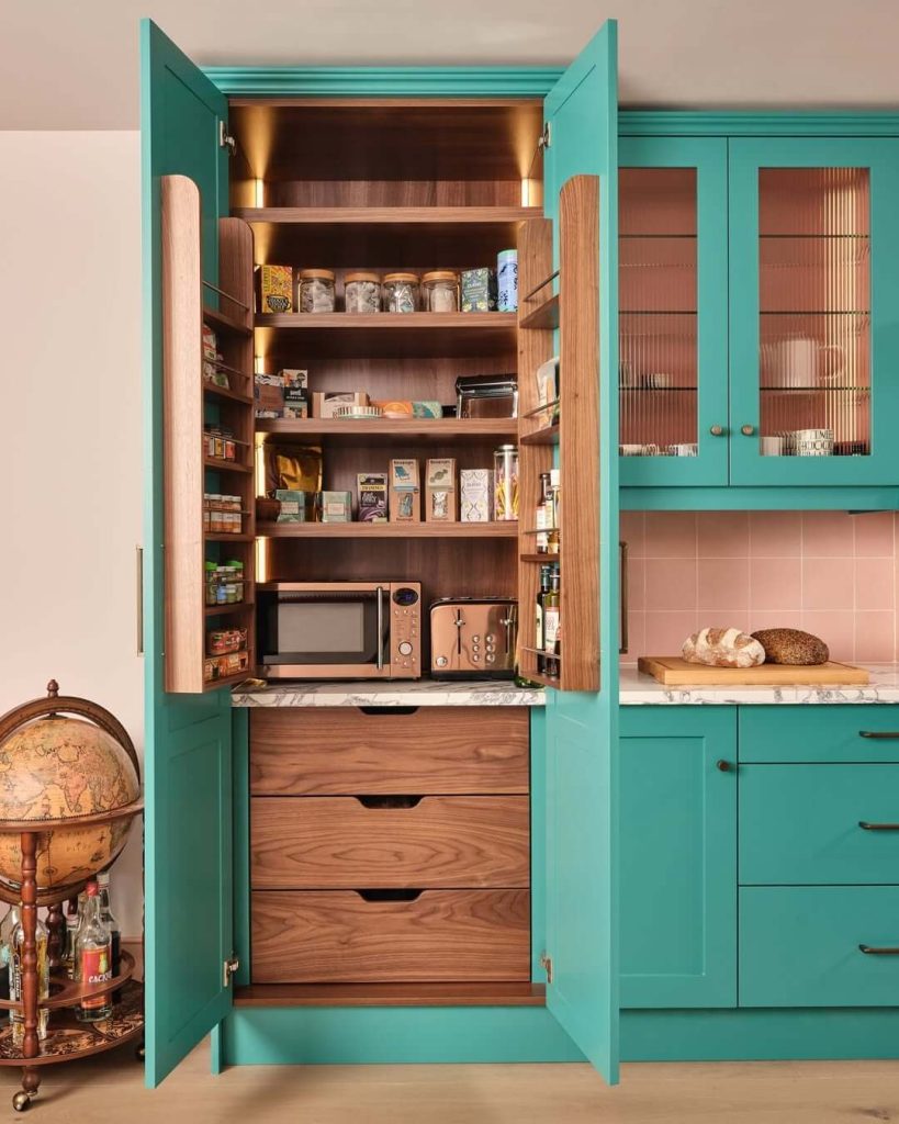 21. Retro Teal Pantry with Warm Walnut and Built-In Lighting