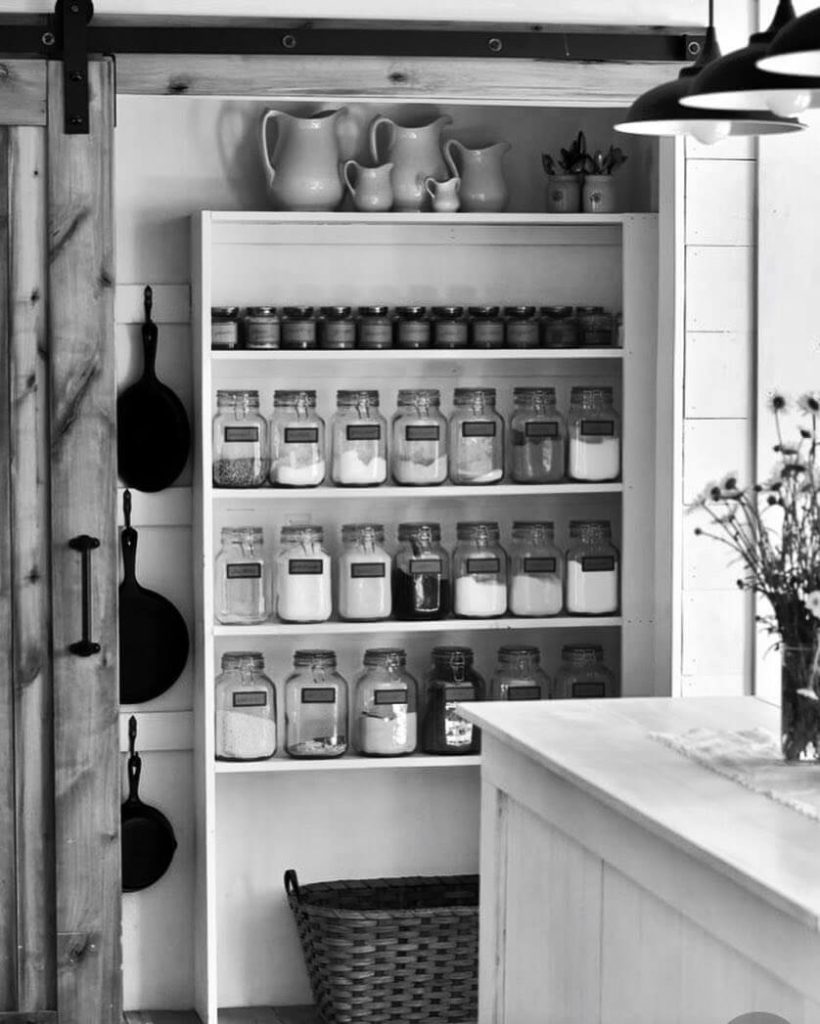22. Minimalist Shelf Pantry with Uniform Glass Jars