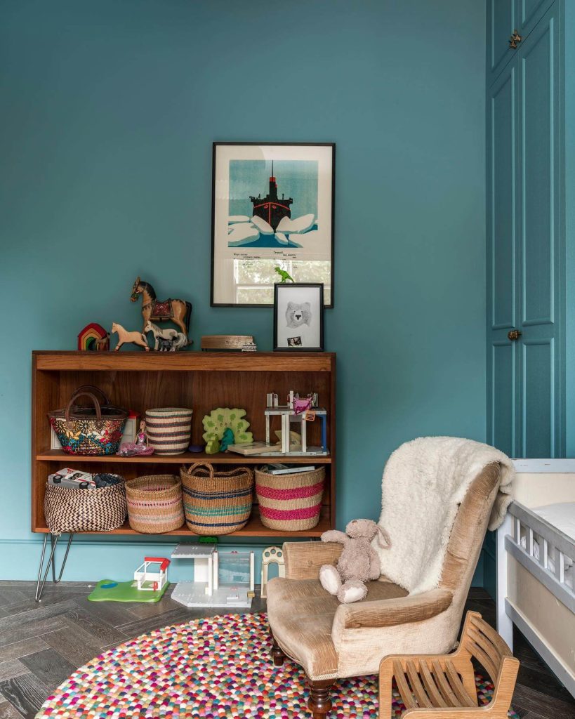 23. Bright and Fun Kid’s Room with Bold Blue Walls