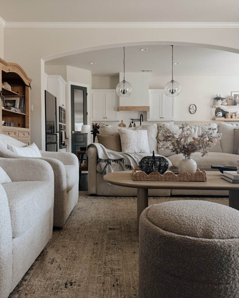 29. Keep It Cozy with Plush Neutrals and Subtle Pumpkin Accents