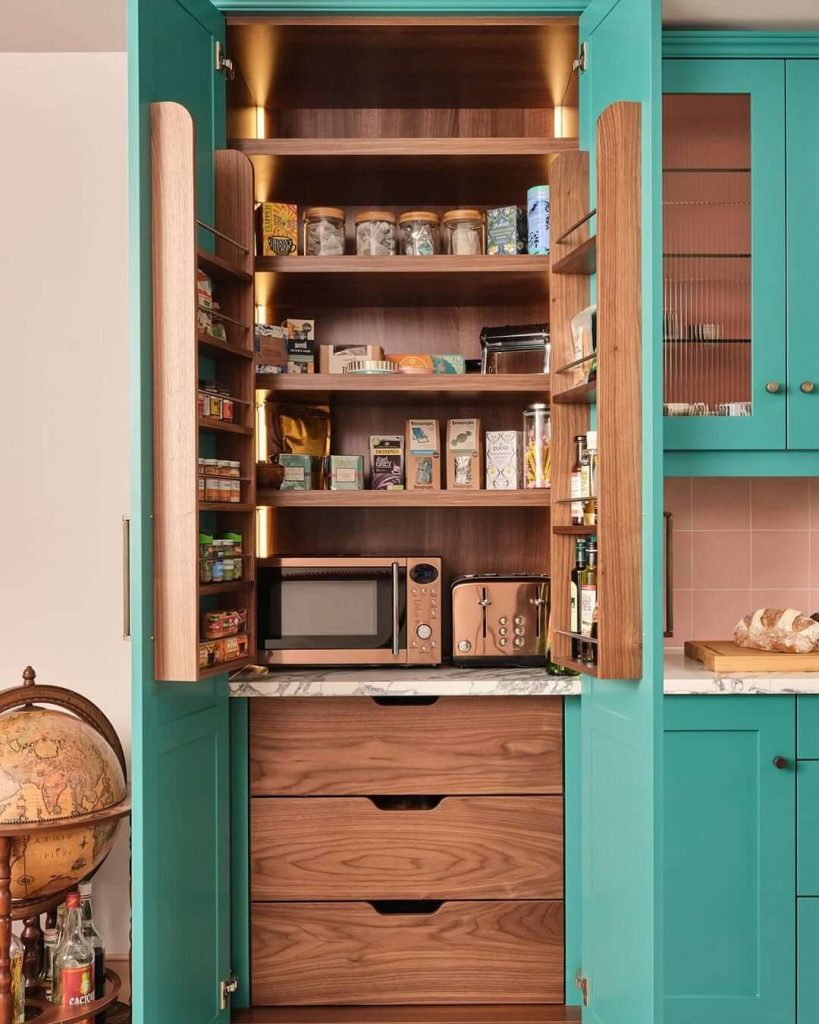 3. Bold and Beautiful Teal Pantry Cabinet