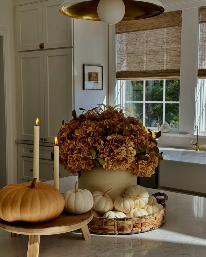 31. Create a Warm Fall Kitchen Vignette with Mini Pumpkins and Florals