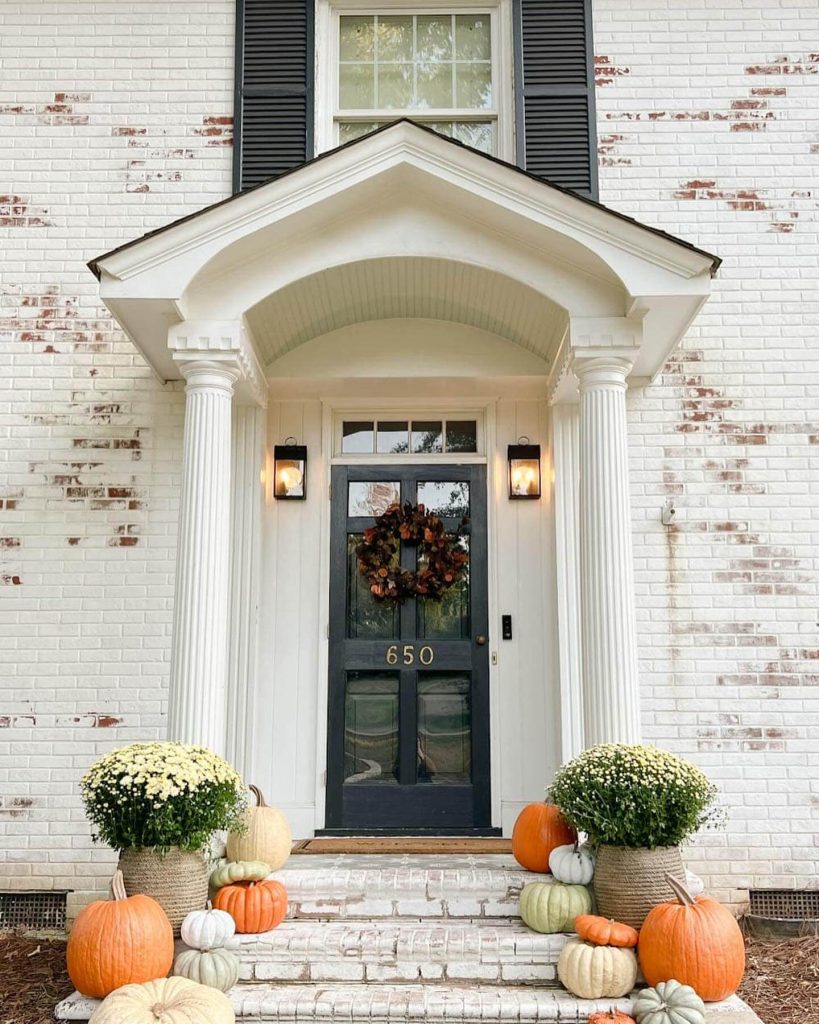 32. Style a Classic Porch with Symmetrical Pumpkin Stacks