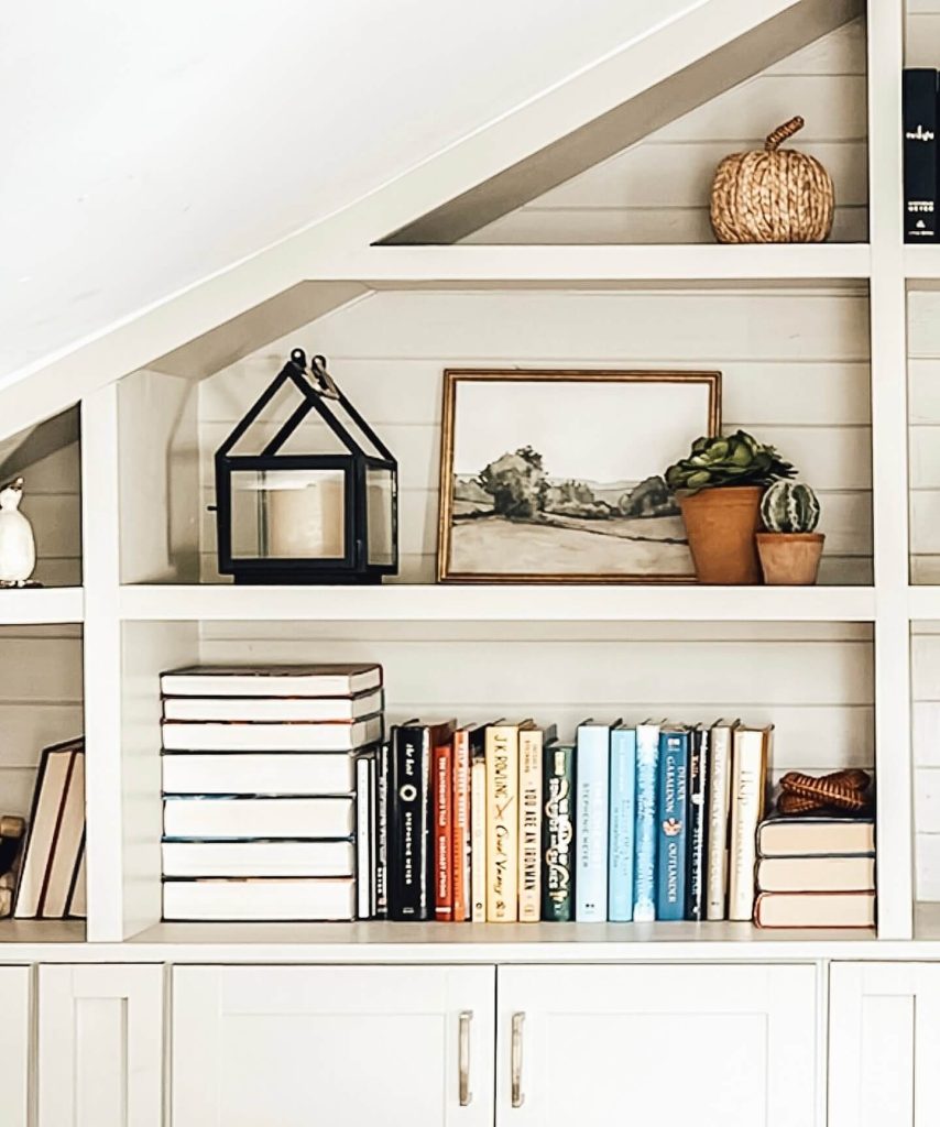 37. Style Your Shelves with Subtle Fall Accents