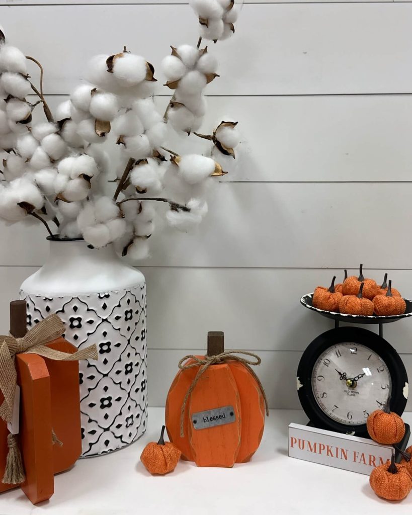 4. Add Whimsical Touches with Mini Pumpkins and Cotton Stems