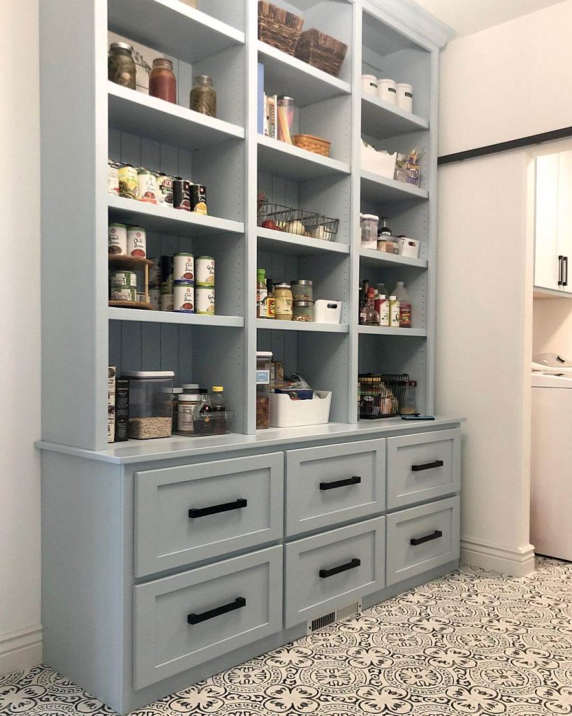 5. Built-In Beauty: Soft Blue Cabinetry With Classic Open Storage