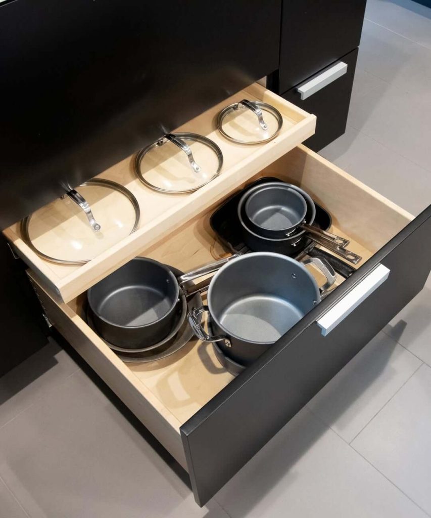 5. Utilize Drawer Fronts for Hidden Lid Storage