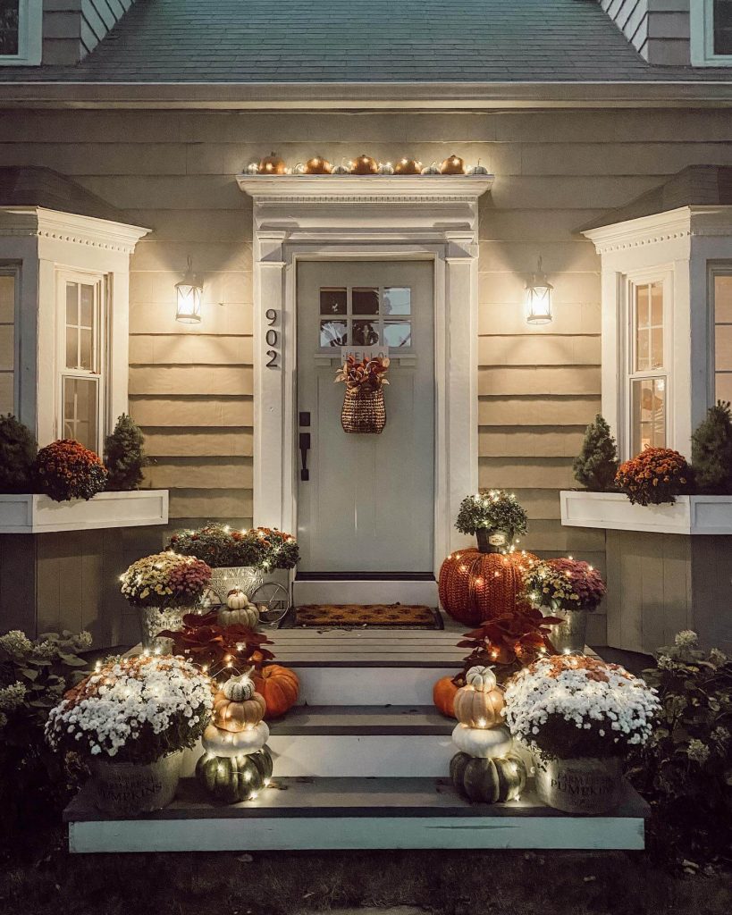 6. Twinkle Lights and Pumpkin Towers for Cozy Curb Appeal