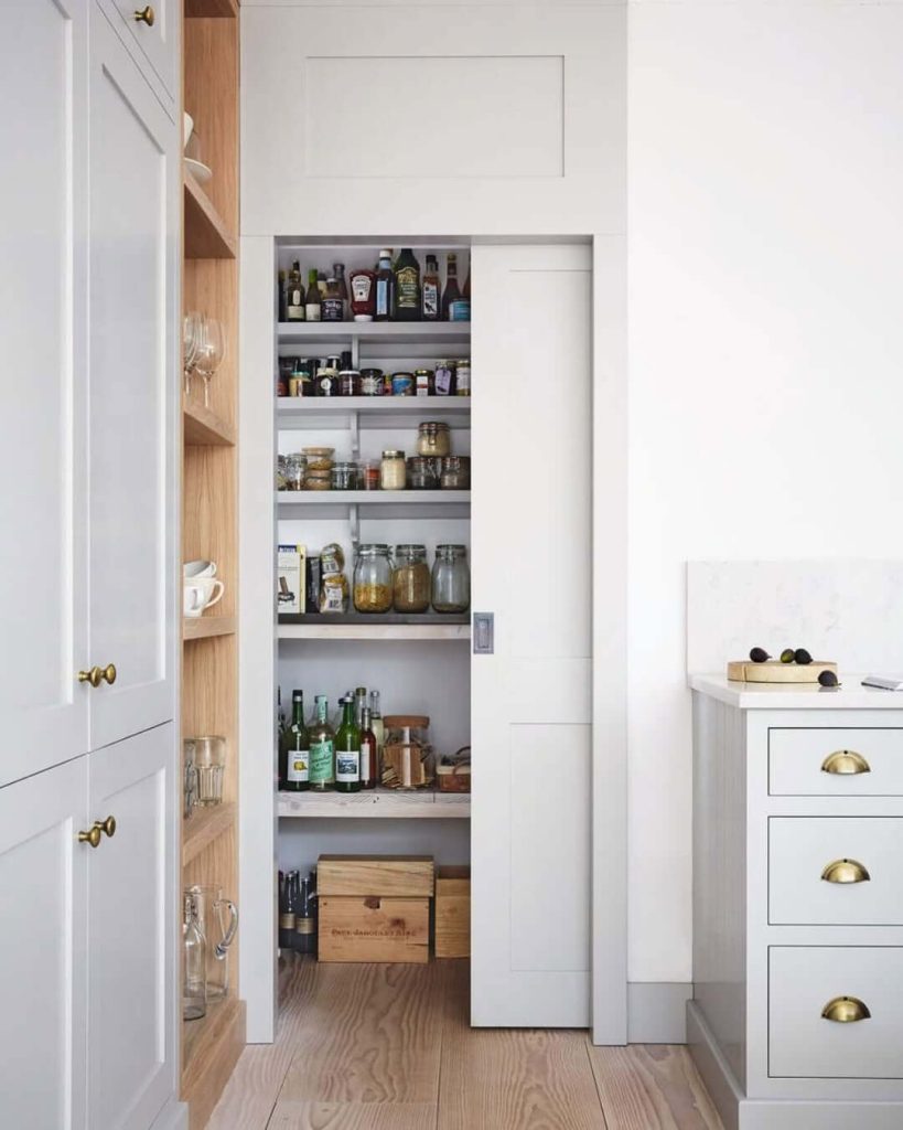 7. Minimalist Pantry Behind a Sliding Door